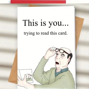 man - Trying to read birthday card